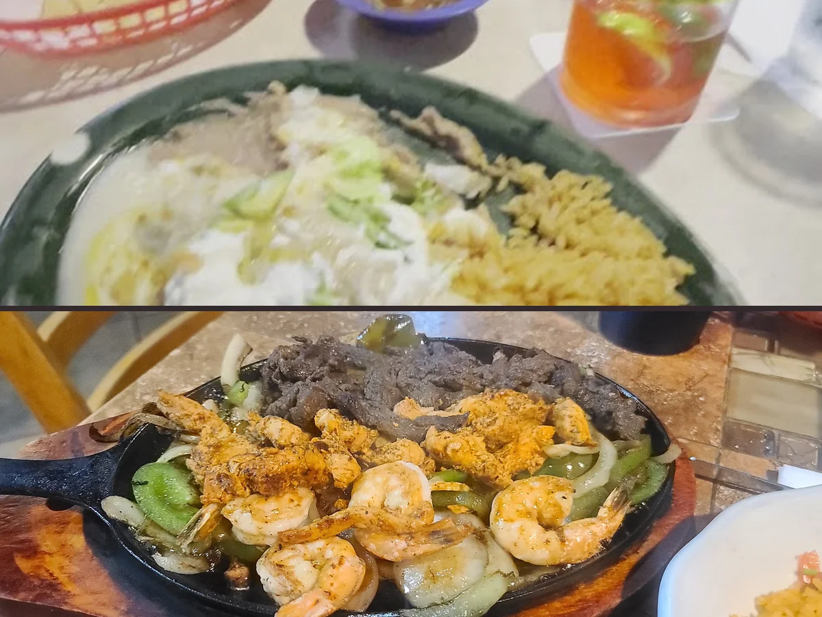 Shared plates on a lively restaurant table.